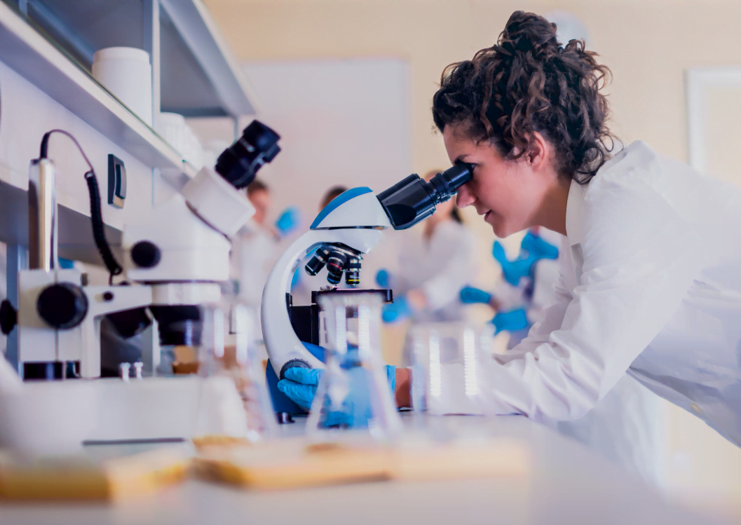 Doctor looking under a microscope