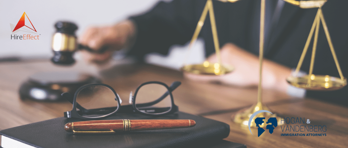 HireEffect Case Study with HV Law header image with glasses, a pen, a notebook, and scales.